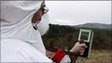 A scientist monitors radiation